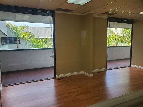 TILE AND WOOD FLOOR RECEPTION AREA. 5 OFFICES AND LARGE ROOM